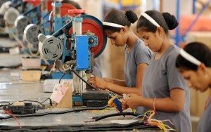 (FILES) In this photograph taken on May 24, 2012 Indian women work at the electrical wiring section of the OREVA E Bike manufacturing facility near Samakhiali of Kutch district, some 240 kms from Ahmedabad.   India's industrial output grew just 0.1 percent in April year-on-year, official data showed June 12, 2012, adding to concerns about the economy and raising the chances of an interest rate cut next week.
AFP PHOTO / Sam PANTHAKY/ FILES        (Photo credit should read SAM PANTHAKY/AFP/GettyImages)