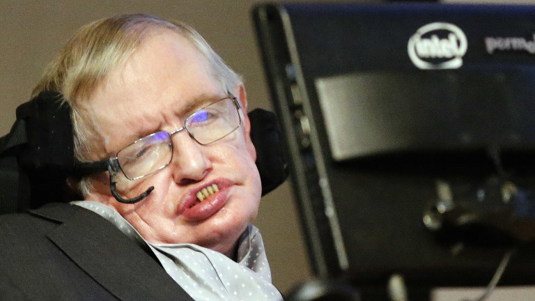 FILE - In this Dec. 16, 2015 file photo, professor Stephen Hawking listens to a news conference in London. The National Oceanic and Atmospheric Administration Tuesday, Sept. 20, 2016, said that August’s temperature of 61.74 degrees (16.52 Celsius) was the 16th month in a row that Earth set a record for the hottest month. NOAA monitoring chief Deke Arndt said it was also the hottest summer, with 2016 on pace to smash last year’s record for the hottest year. (AP Photo/Frank Augstein, File)