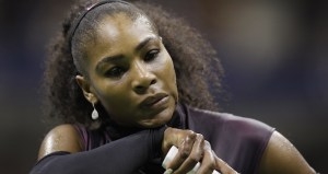 Serena Williams wipes sweat from her face between serves from Karolina Pliskova, of the Czech Republic, during the semifinals of the U.S. Open tennis tournament, Thursday, Sept. 8, 2016, in New York. (AP Photo/Charles Krupa)