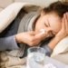 Sick Woman. Flu. Woman Caught Cold. Sneezing into Tissue