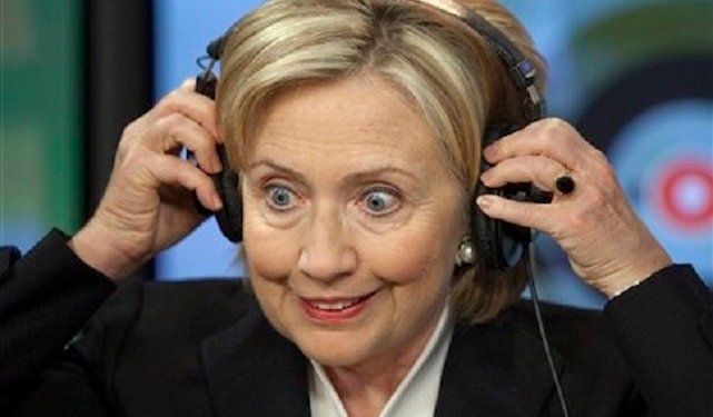 U.S. Secretary of State Hillary Rodham Clinton ajusts headphones  at Echo Moskvy radio station Wednesday morning, Oct. 14, 2009. Clinton is wrapping up a five-day tour of Europe on Wednesday with a series of informal meetings in Moscow and the Russian republic of Tatarstan aimed at helping redefine U.S.-Russian relations. (AP Photo/ Alexander Zemlianichenko)