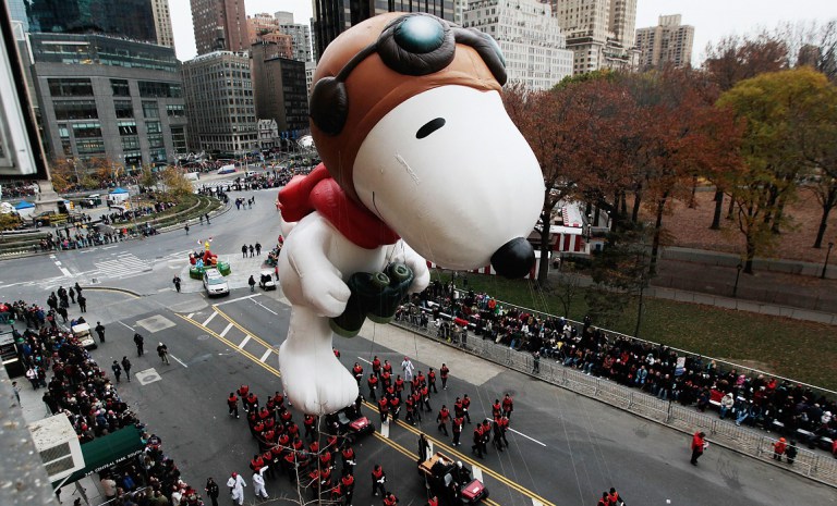 NEW YORK - NOVEMBER 25:  The Snoopy float glides down Central Park South during the Macy's Thanksgiving Day parade  November 25, 2010 in New York City. This year's annual parade features approximately 8,000 participants, 15 giant character balloons and 43 novelty balloons.  (Photo by Chris Hondros/Getty Images)