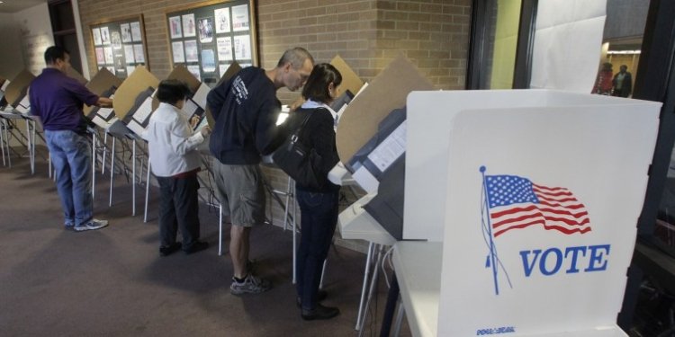 FILE - This Oct. 30, 2012 file photo shows people voting early at the Salt Lake County Government Building in Salt Lake City, ahead of the Nov. 6 election. Theres always grousing about people who dont bother to vote. But look at it another way: An estimated 133 million Americans will cast ballots in Tuesdays election. Thats about 6 in 10 eligible adults. Some will persevere despite long lines, pressing personal burdens or the devastation left by Superstorm Sandy. Why do they do it? Its not because any one voter will decide the contest between President Barack Obama and Mitt Romney. Depending on which state they live in, the odds of casting a deciding vote for president are somewhere between 1 in a million and essentially zero. (AP Photo/Rick Bowmer, File)