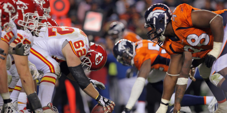 DENVER - NOVEMBER 14: Center Casey Wiegman #62 of the Kansas City Chiefs snaps the ball as the Chiefs offensive line takes on the defensive line of the Denver Bronco at INVESCO Field at Mile High on November 14, 2010 in Denver, Colorado. The Broncos defeated the Cheifs 49-29. (Photo by Doug Pensinger/Getty Images)