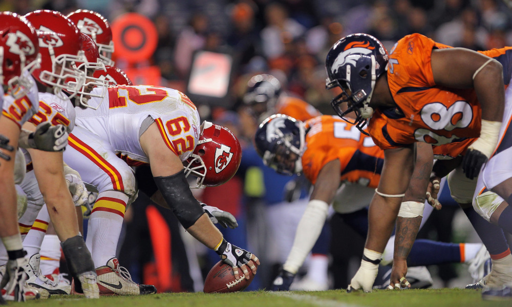 DENVER - NOVEMBER 14:  Center Casey Wiegman #62 of the Kansas City Chiefs snaps the ball as the Chiefs offensive line takes on the defensive line of the Denver Bronco at INVESCO Field at Mile High on November 14, 2010 in Denver, Colorado. The Broncos defeated the Cheifs 49-29.  (Photo by Doug Pensinger/Getty Images)