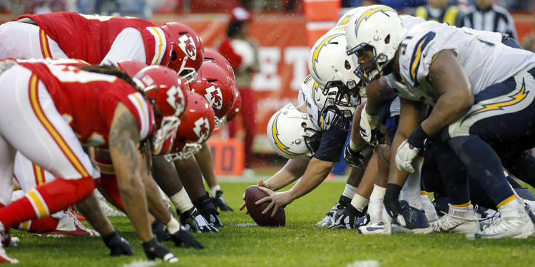 The Kansas City Chiefs defense gets set at the line of scrimmage against the San Diego Chargers offense during an NFL football game on Sunday, Dec. 13, 2015 in Kansas City, Mo. The Chiefs won, 10-3. (G. Newman Lowrance via AP)