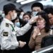 GUAGZHOU, CHINA - JANUARY 22: Citizens wear masks to defend against new viruses on January 22,2020 in Guangzhou, China.The 2019 new coronavirus, known as "2019-nCoV", was discovered in Wuhan virus pneumonia cases in 2019, and the virus was transmitted from person to person. Currently, confirmed cases have been received in various parts of the world. ( Stringer - Anadolu Agency )