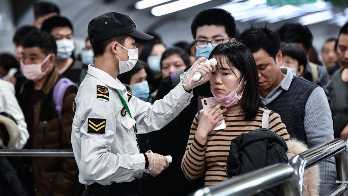 GUAGZHOU, CHINA - JANUARY 22: Citizens wear masks to defend against new viruses on January 22,2020 in Guangzhou, China.The 2019 new coronavirus, known as "2019-nCoV", was discovered in Wuhan virus pneumonia cases in 2019, and the virus was transmitted from person to person. Currently, confirmed cases have been received in various parts of the world. ( Stringer - Anadolu Agency )